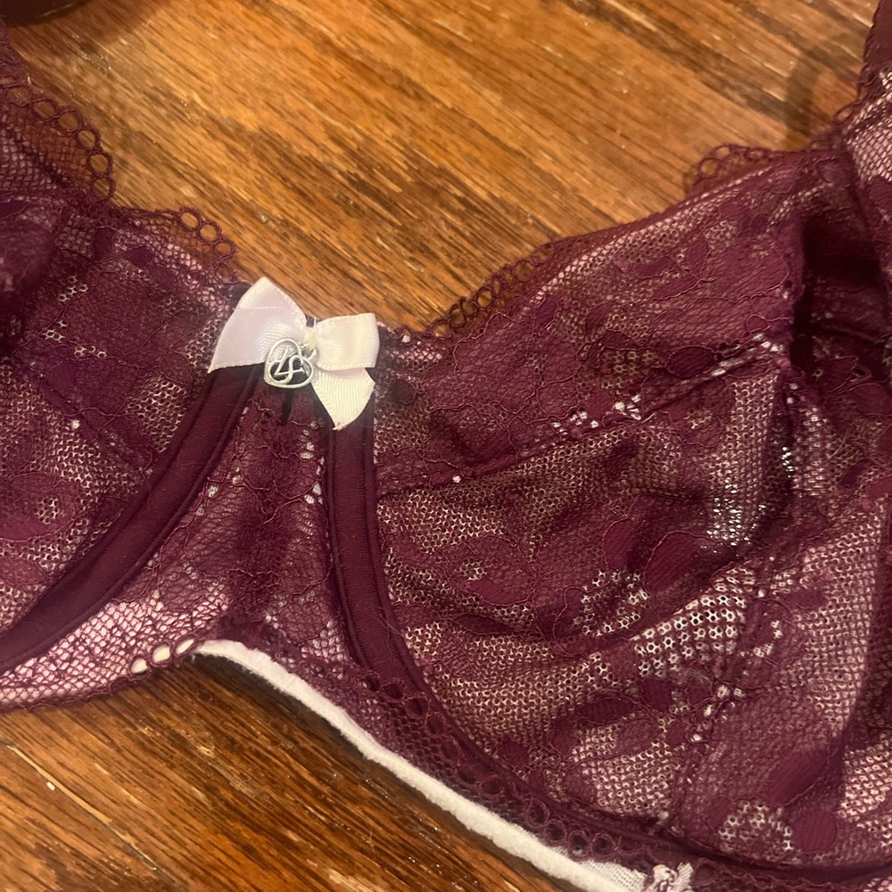 Beautiful maroon lace body by Victoria bra with logo on small bow. 34dd.